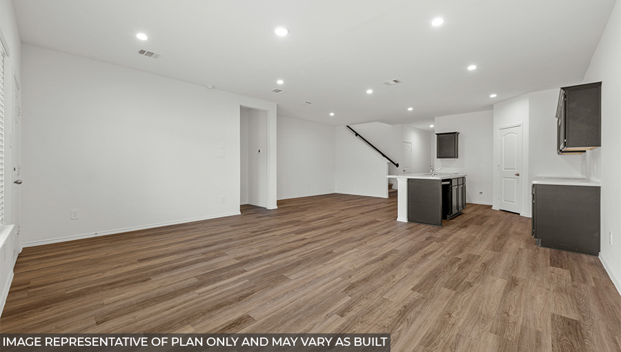 Spacious living area with vinyl flooring and bright windows in Conroe TX