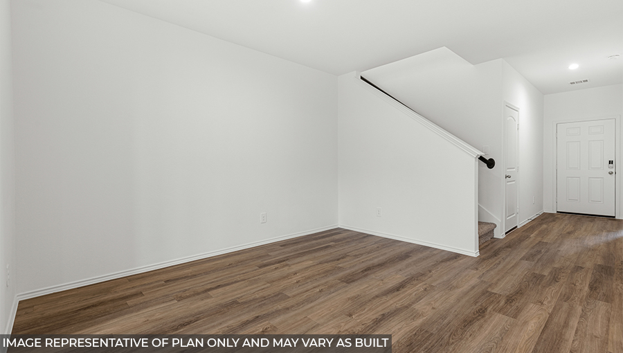 Spacious living area with vinyl flooring and bright windows in Conroe TX