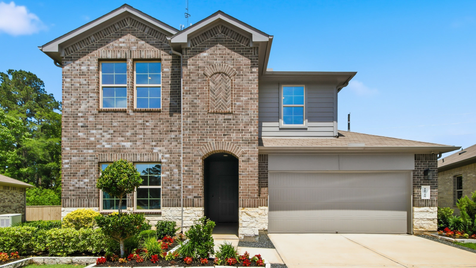 two story house with 2 car garage