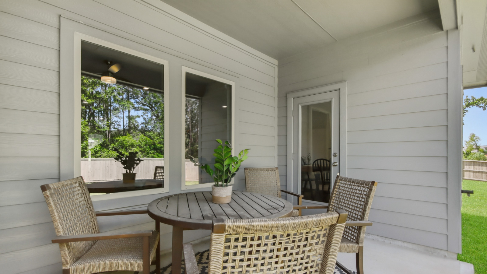 covered patio with jamies hardie siding and overhead lighting