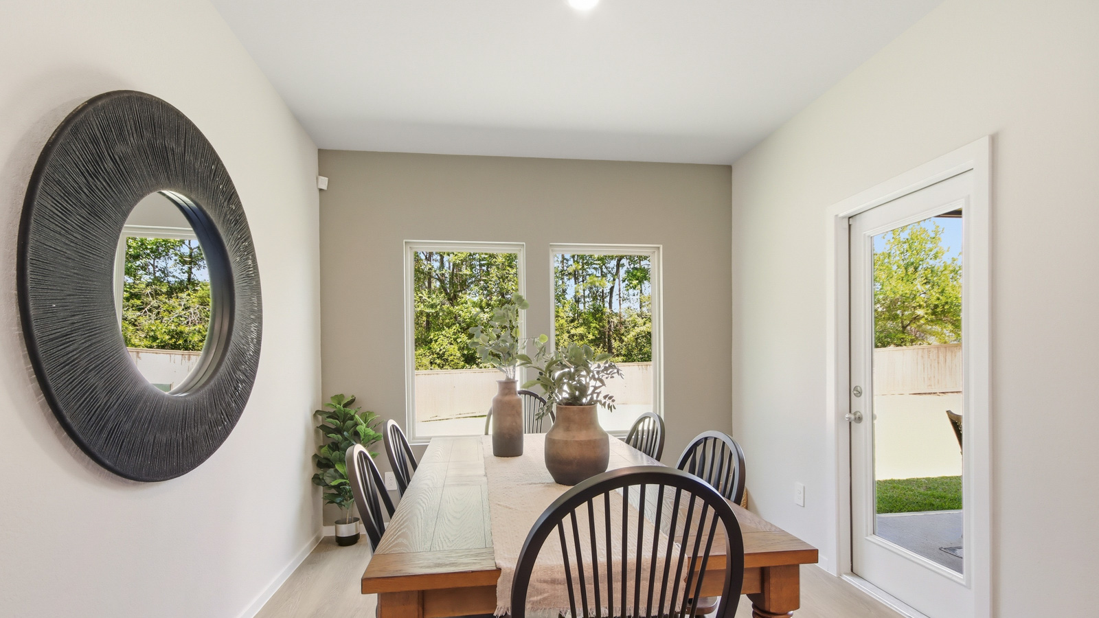 Dining area with vinyl flooring located off from the living room area in Willis TX