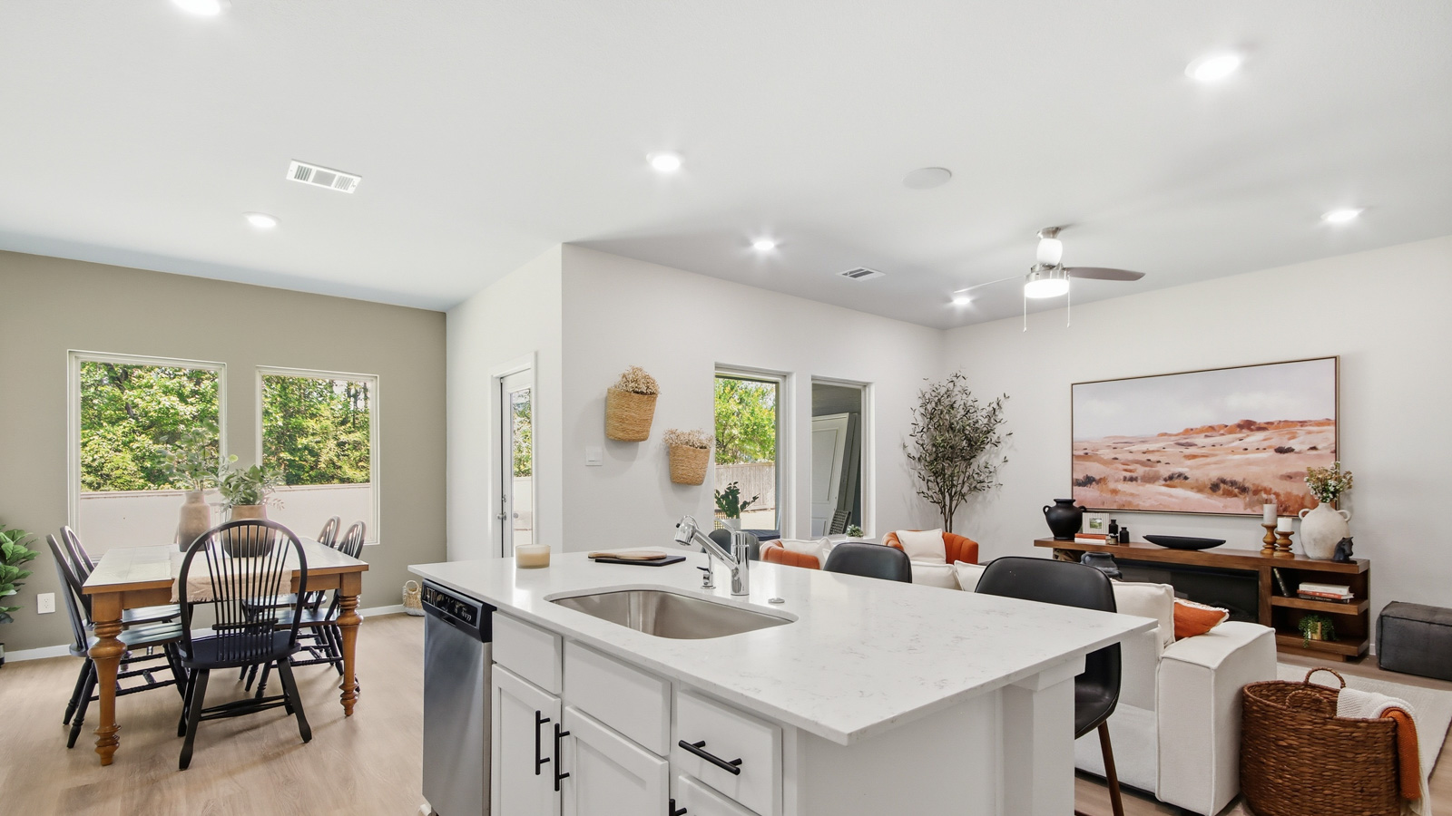 Kitchen with quartz countertops and an island and vinyl floor