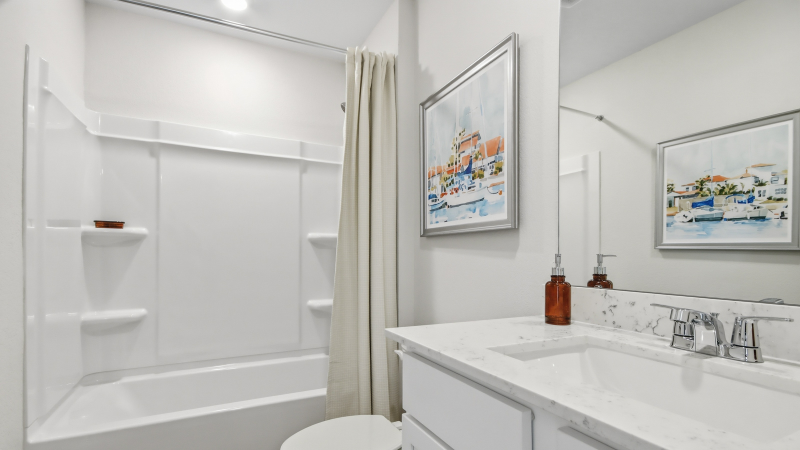Secondary bathroom with tub/shower combo with quartz counter tops in Willis TX