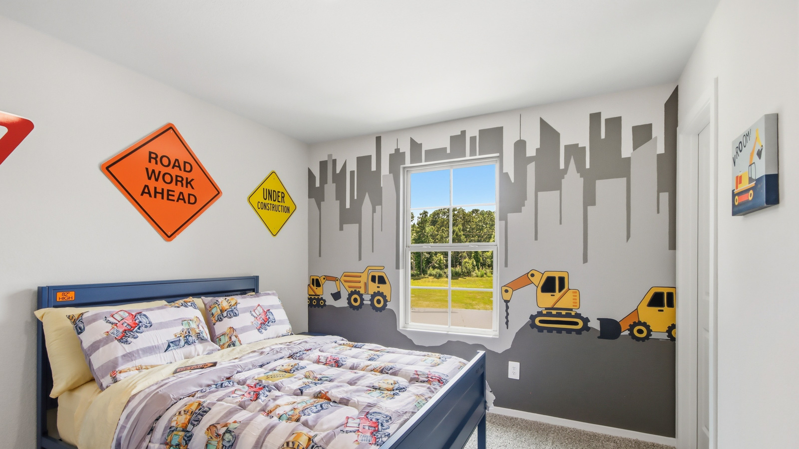 Second level secondary bedroom with carpet flooring and bright window