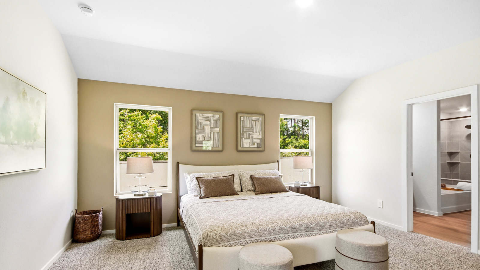 Large Primary bedroom with shag carpet flooring and bright window