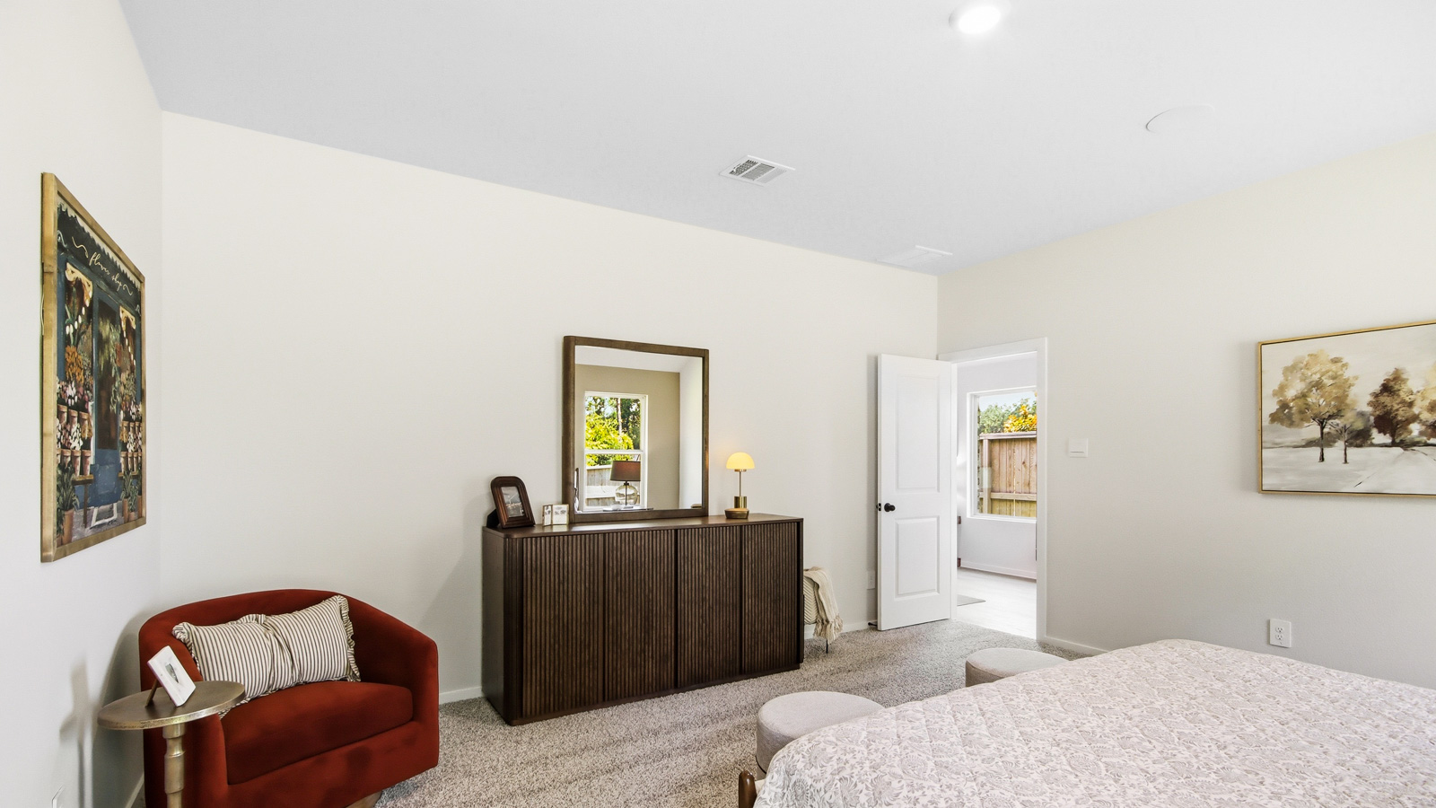 Large Primary bedroom with shag carpet flooring and bright window