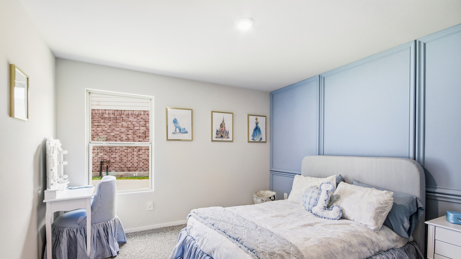 Secondary bedroom with shag carpet flooring and bright window