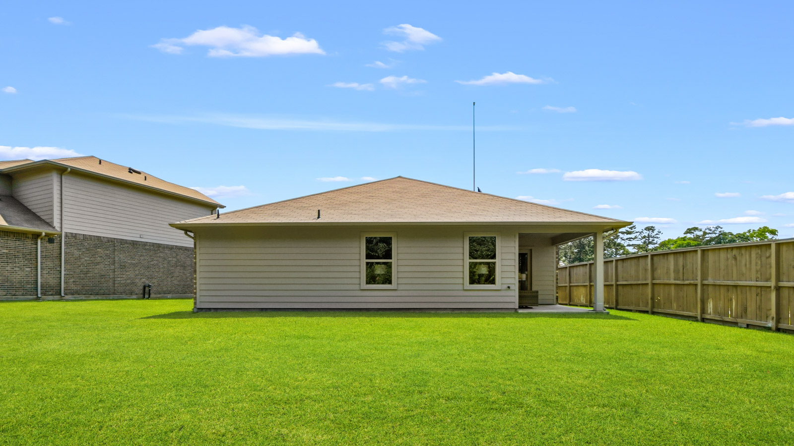 back of house with james hardie siding and glass back door