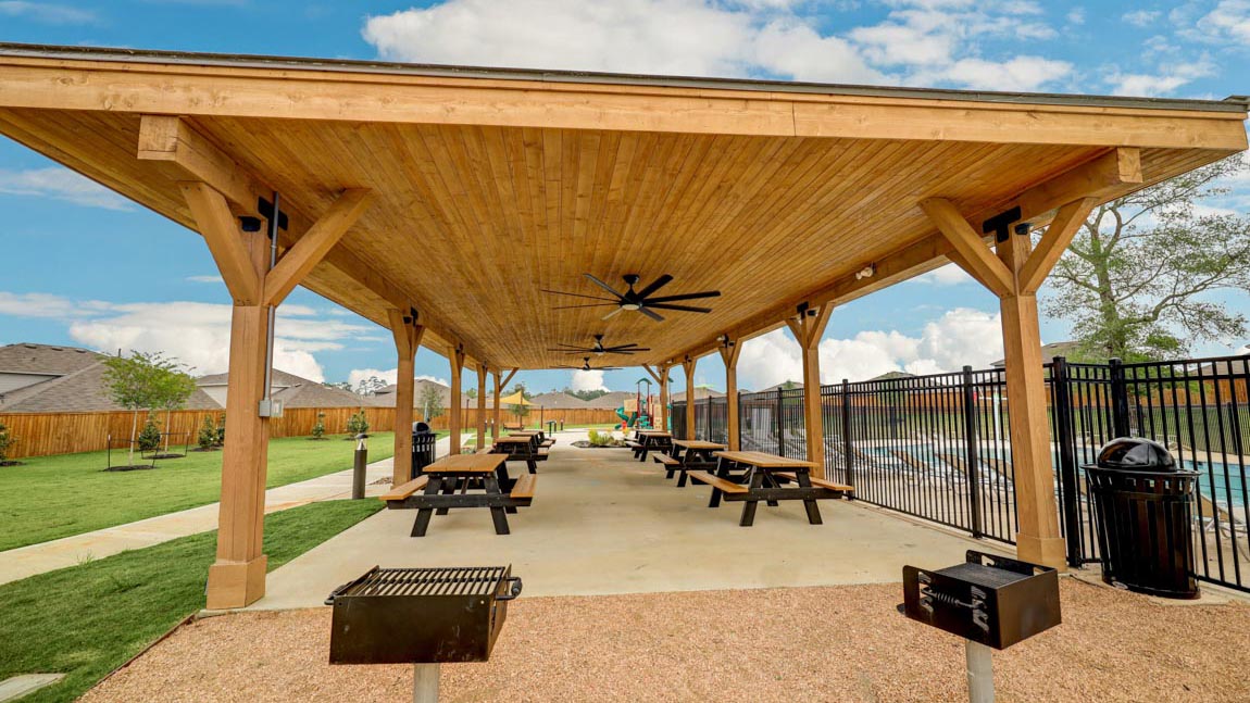 amenities in Mill Creek community located in Magnolia TX. Pool and park and picnic benches and playground