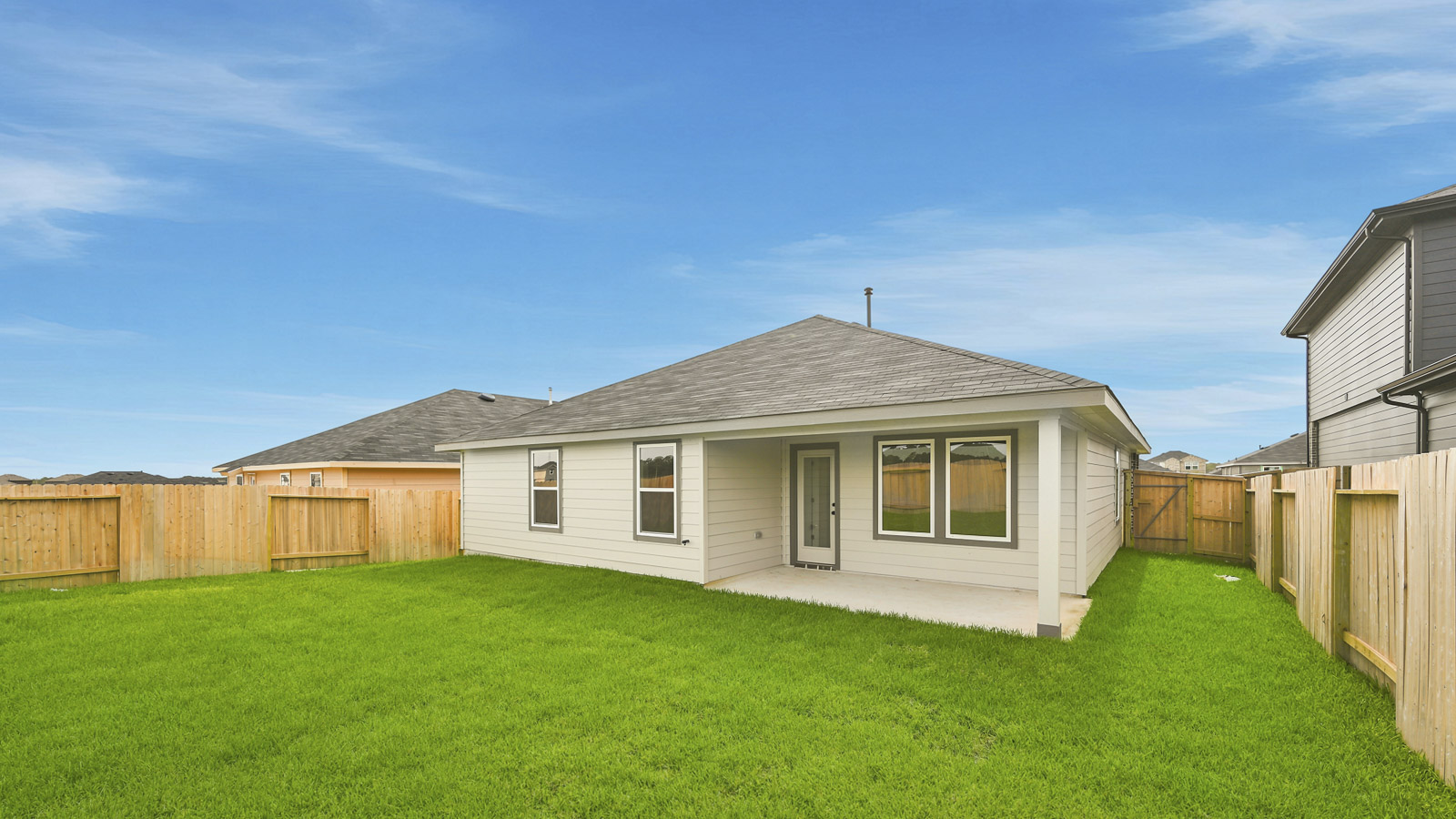 covered patio with jamies hardie siding and overhead lighting