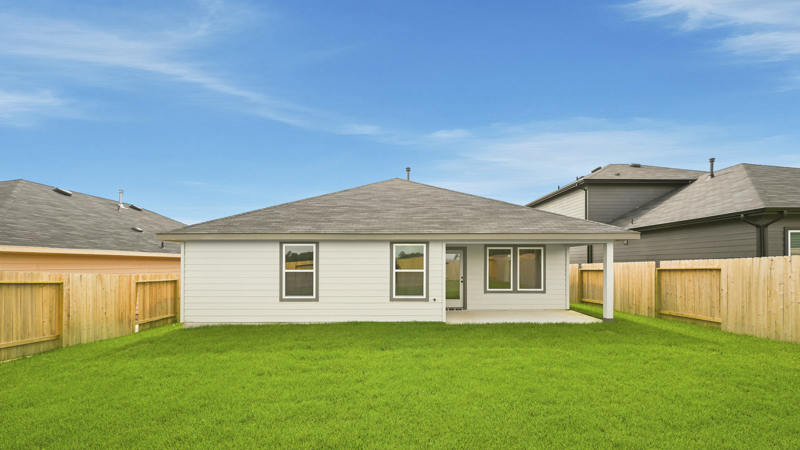 covered patio with jamies hardie siding and overhead lighting