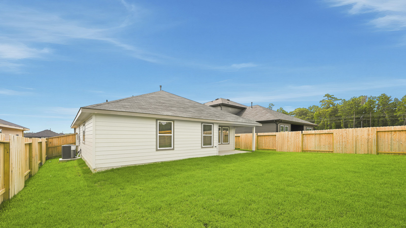 covered patio with jamies hardie siding and overhead lighting