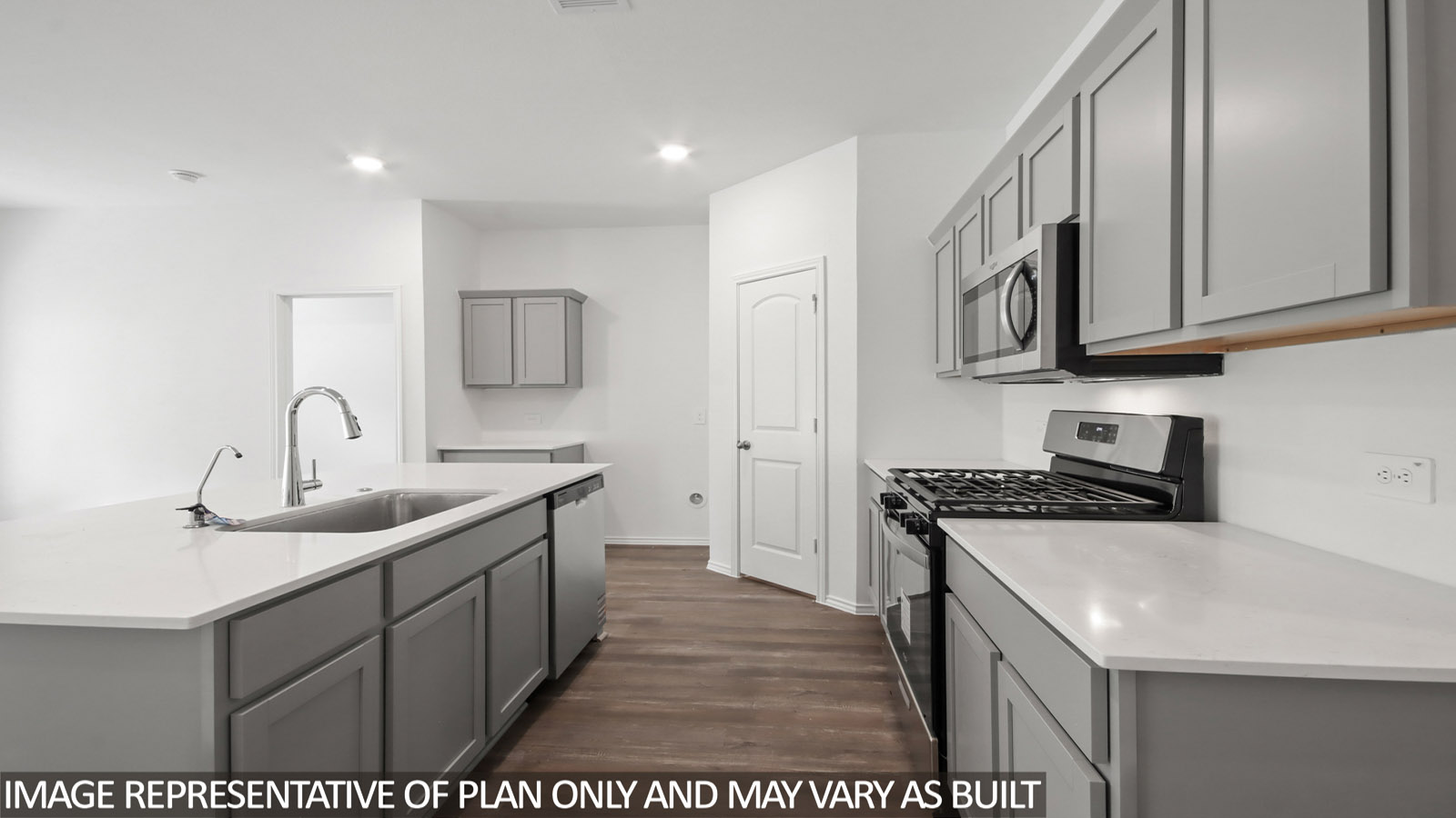 Kitchen with an island and vinyl floor