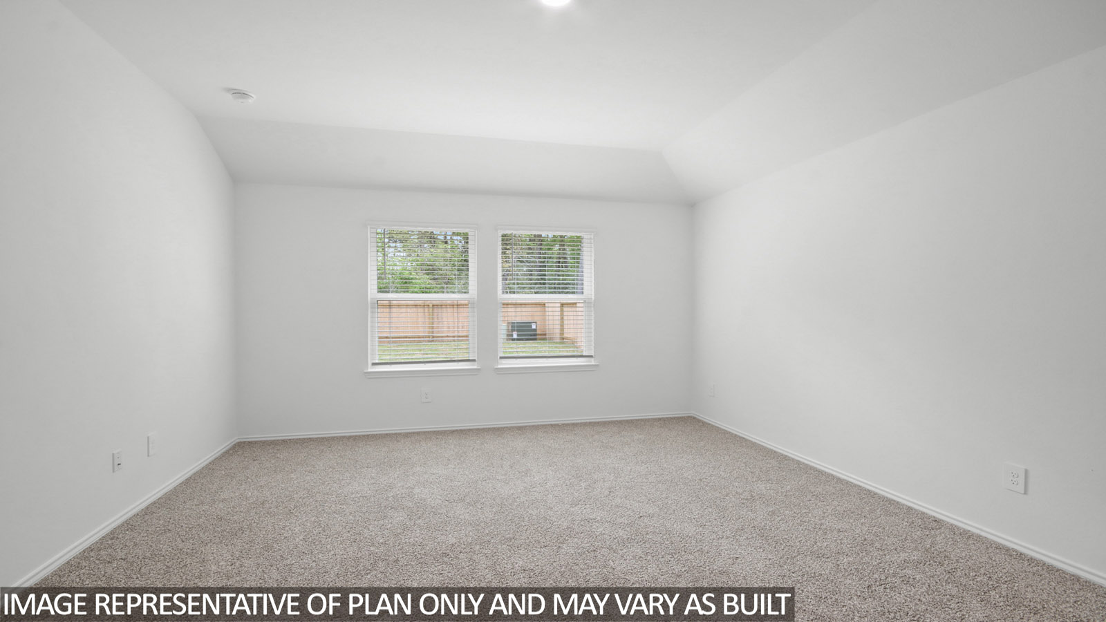 Primary bedroom with carpet flooring