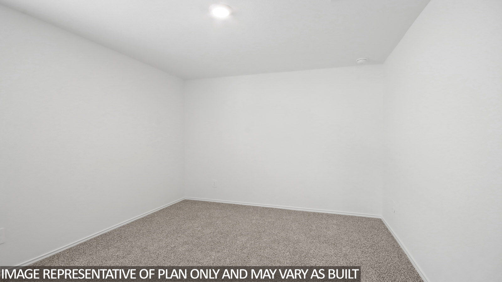 Secondary bedroom with carpet flooring