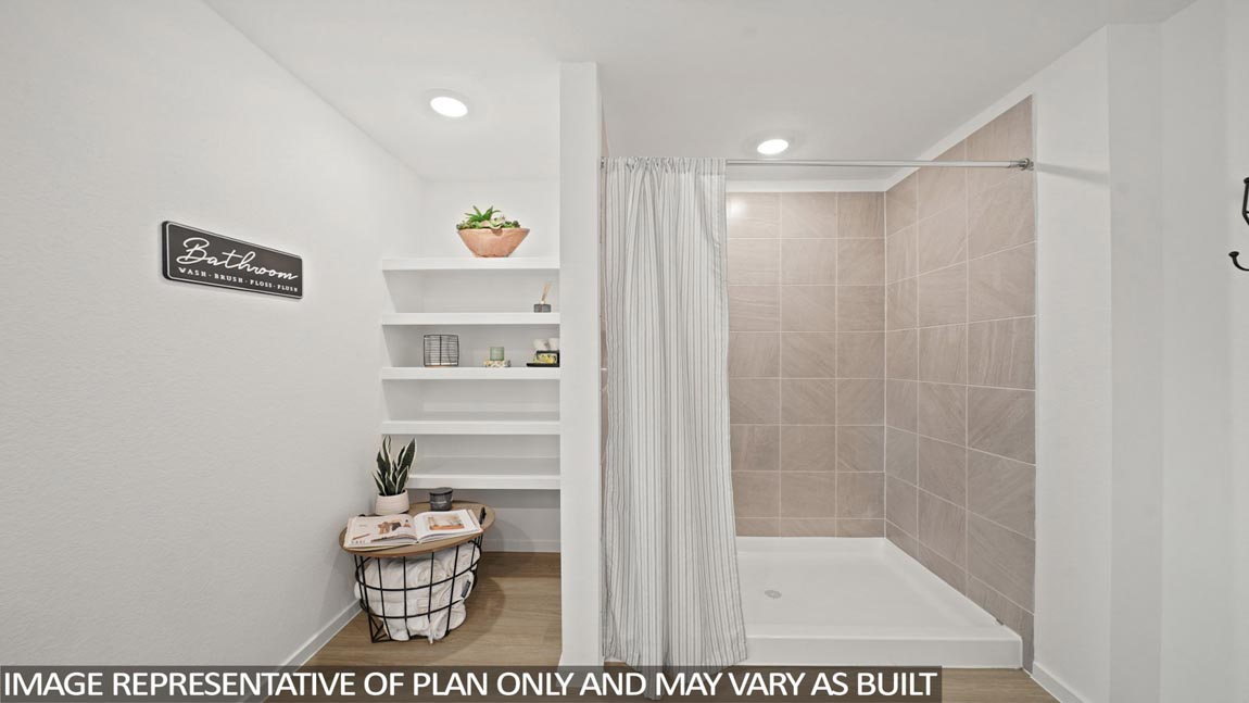 Primary bathroom with shower and linen storage