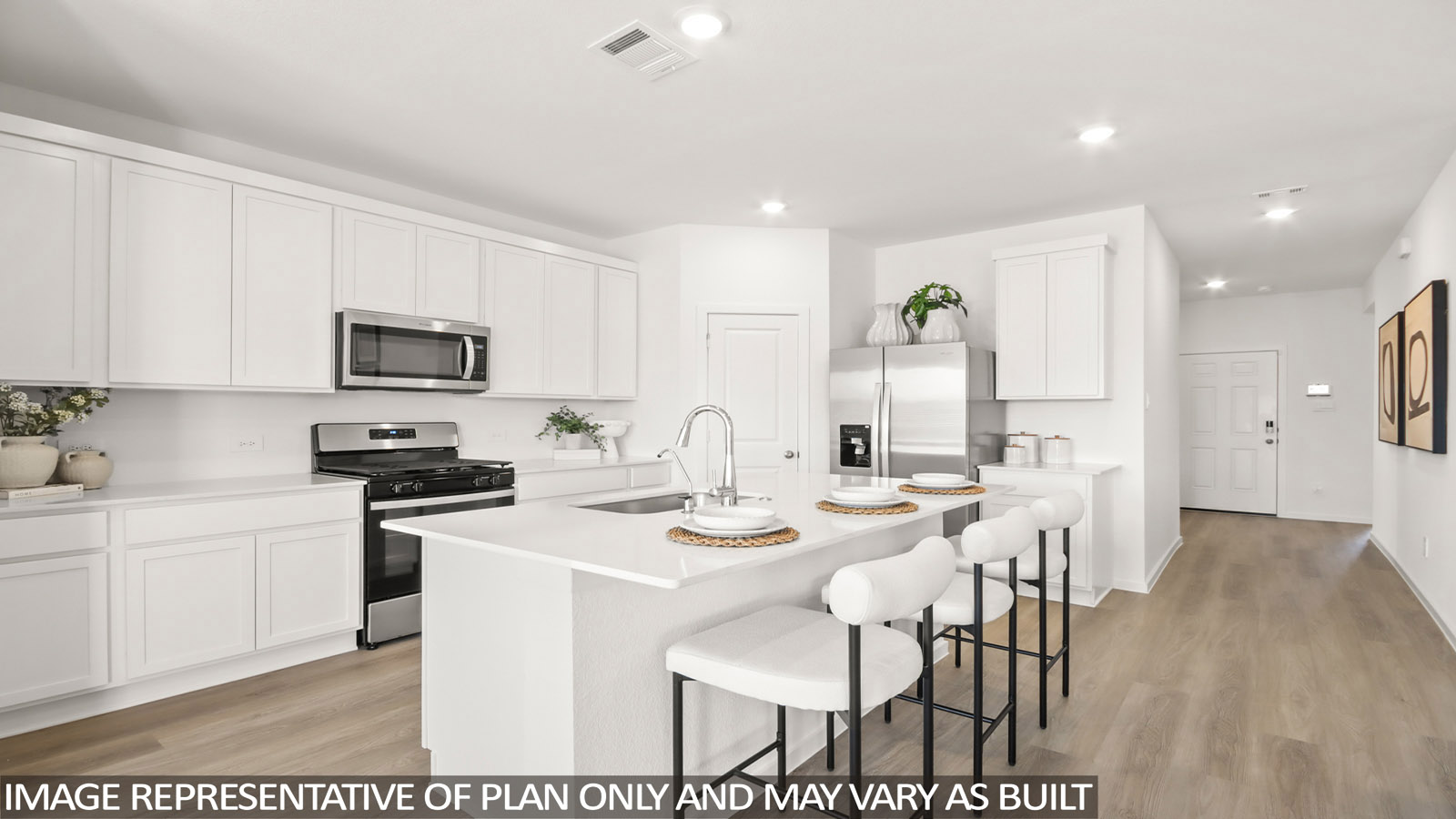 Kitchen with an island and vinyl floor