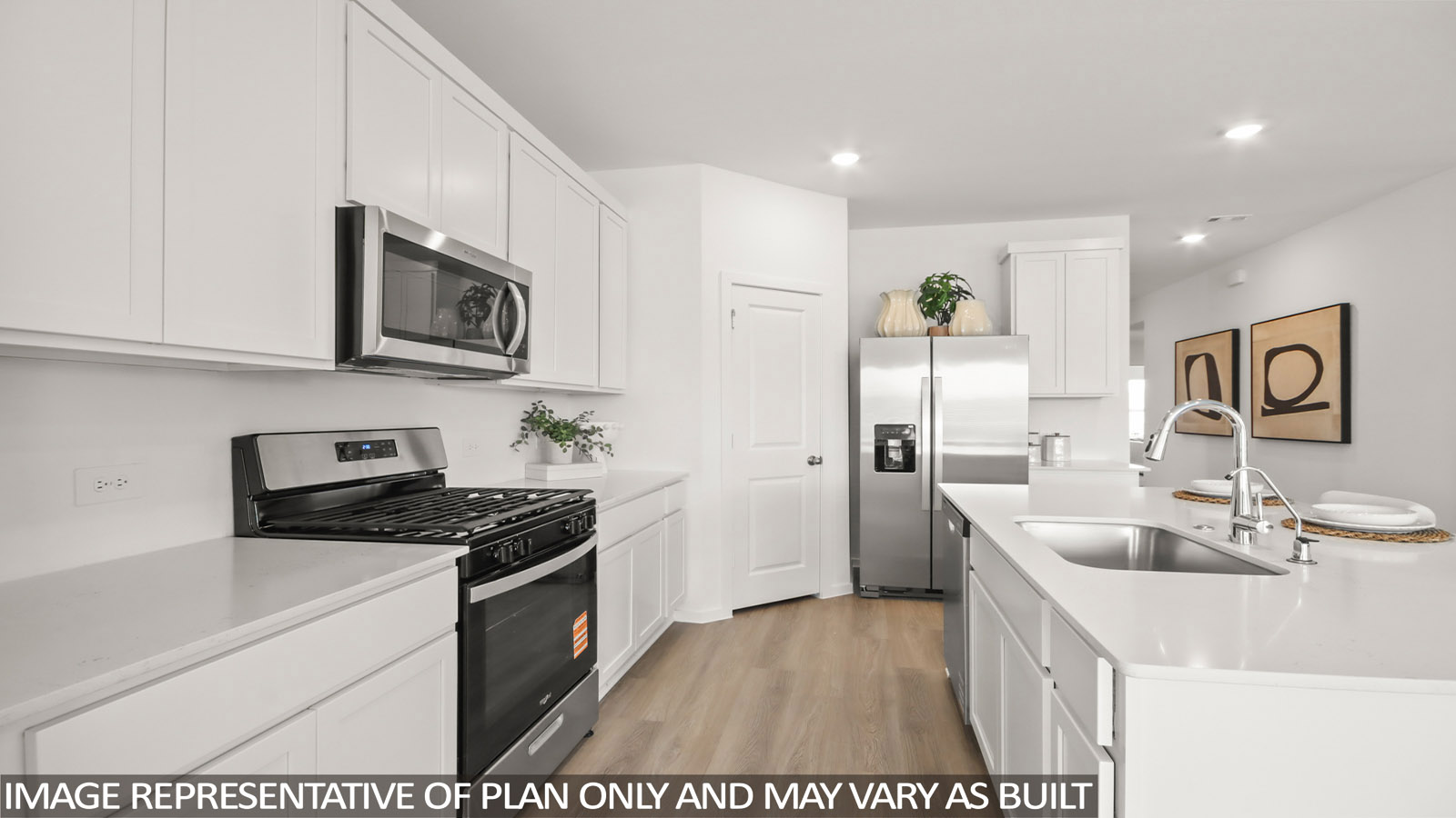 Kitchen with an island and vinyl floor