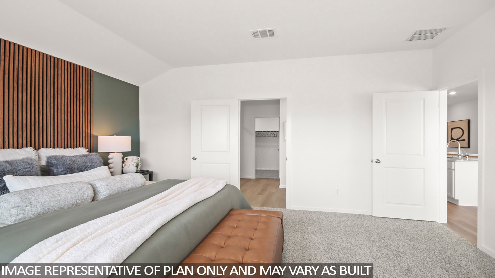 Primary bedroom with carpet flooring