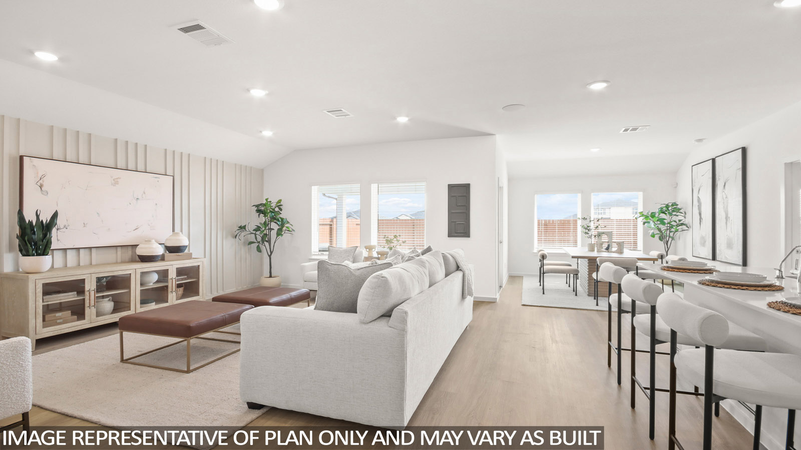 Spacious living area with vinyl flooring