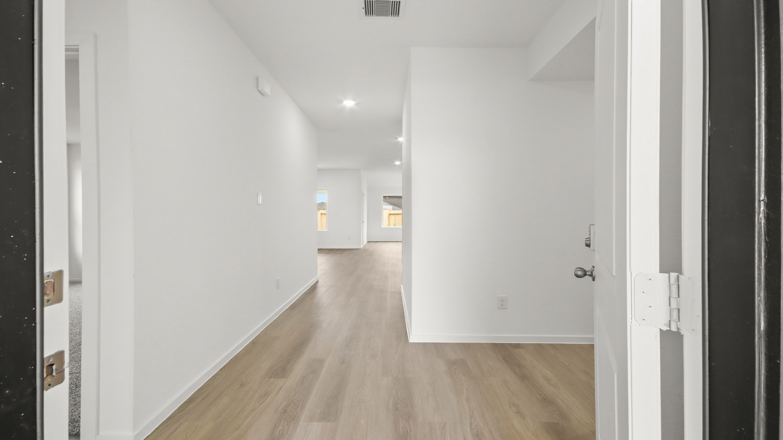 Entry hallway with vinyl flooring sherman williams painted walls