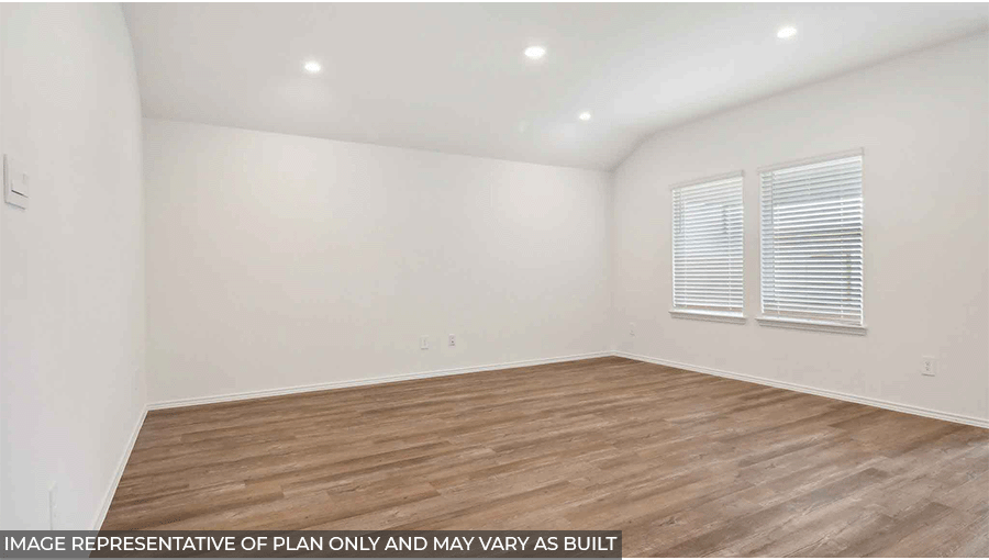 Spacious living area with vinyl flooring