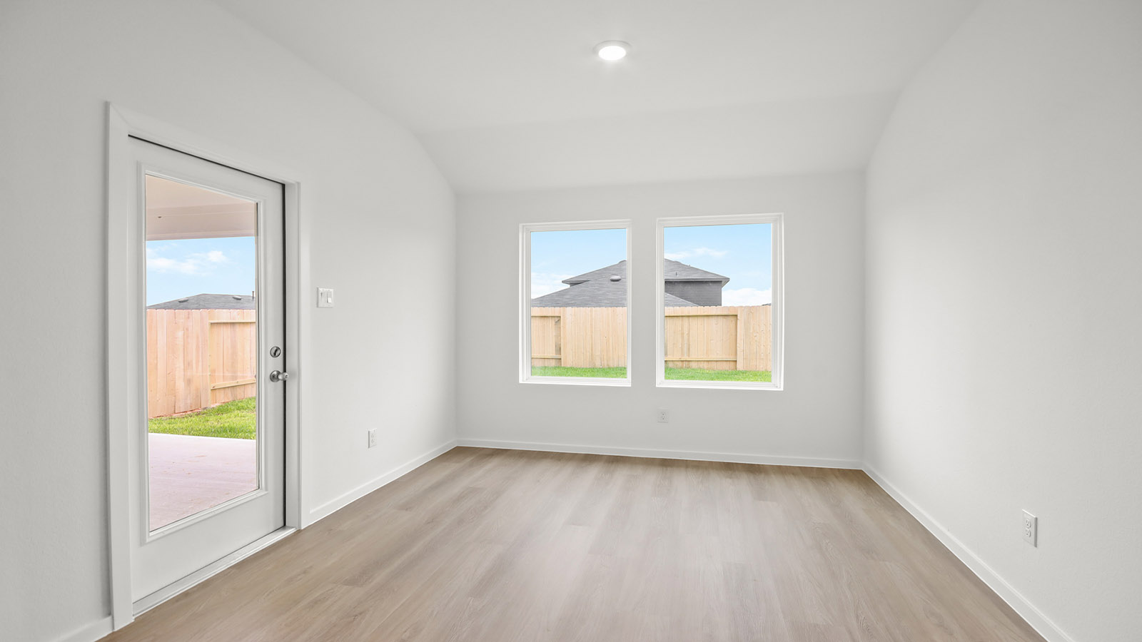Dining area with vinyl flooring located off from the living room area in Magnolia TX