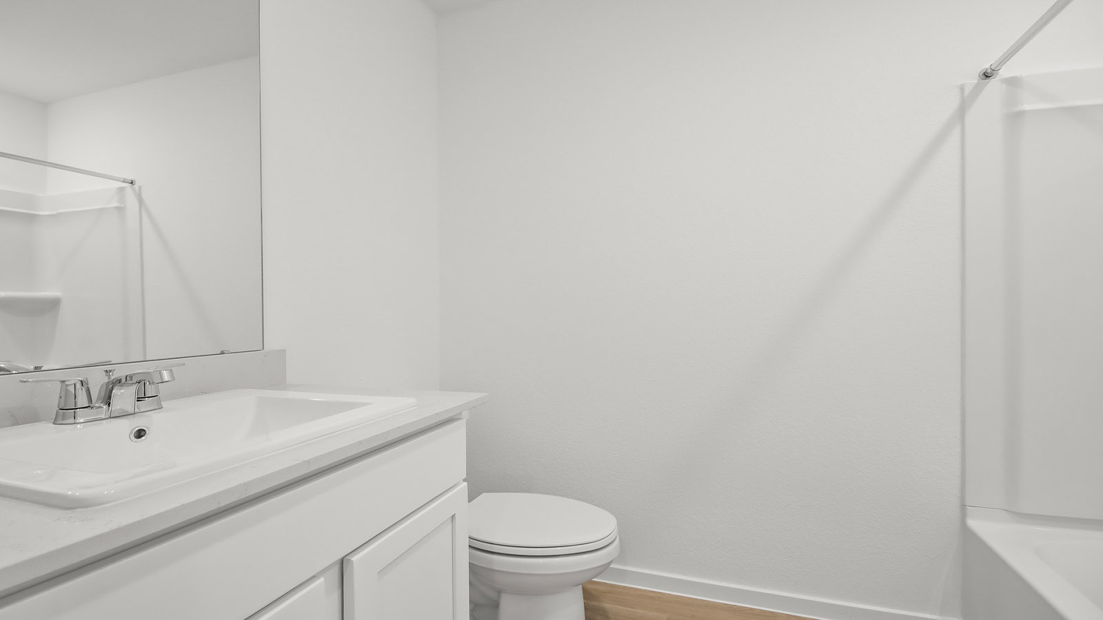 Secondary bathroom with tub/shower combo with quartz counter tops in Magnolia TX