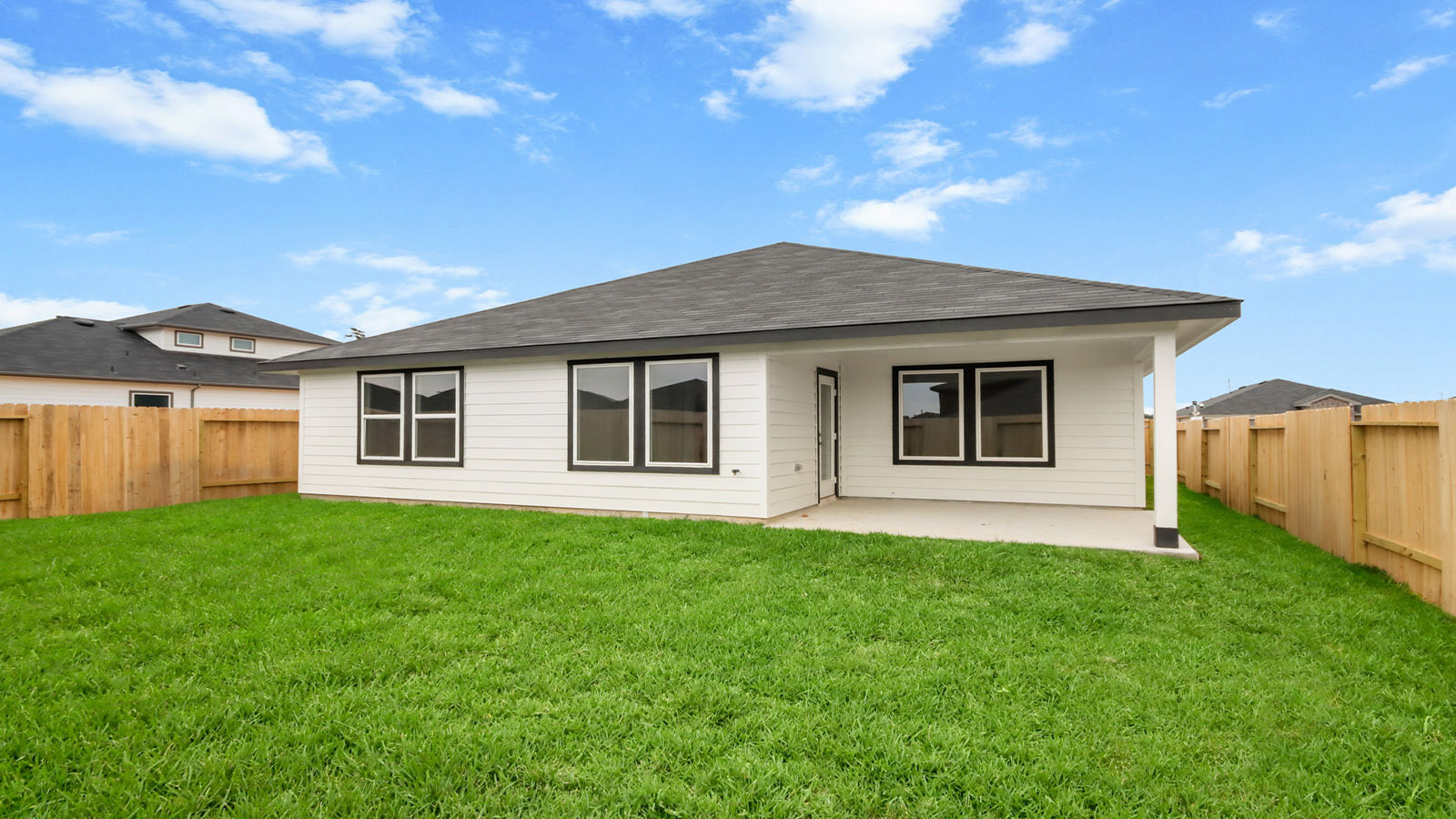 covered patio with jamies hardie siding and overhead lighting