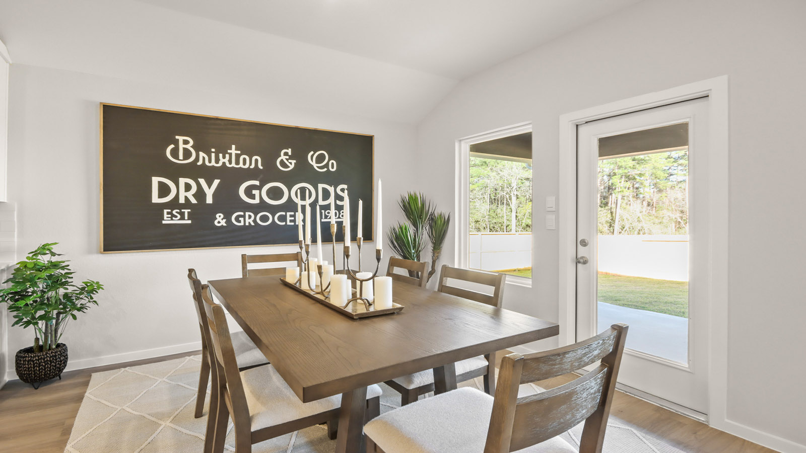 Dining area with vinyl flooring located off from the living room area in Magnolia TX