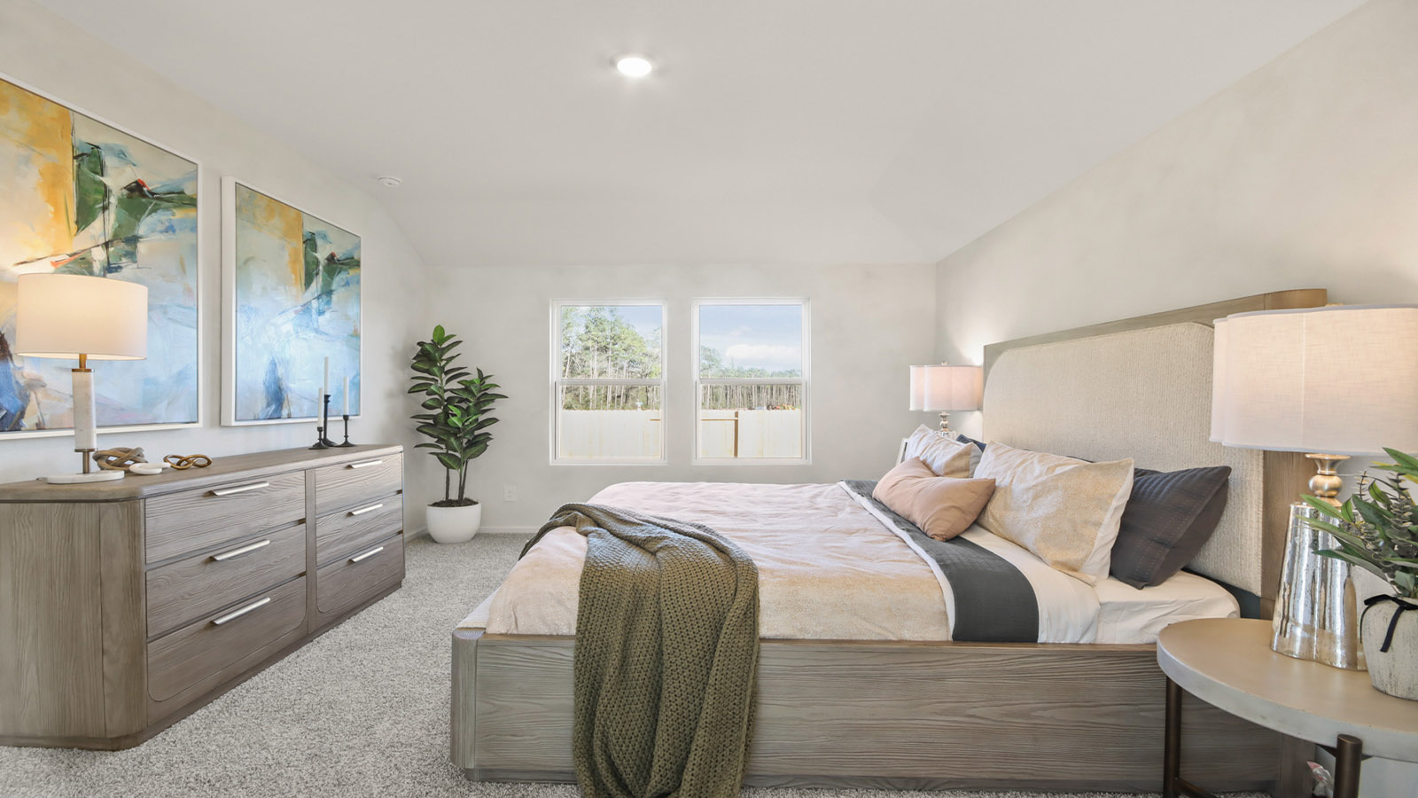 Large Primary bedroom with shag carpet flooring and bright window