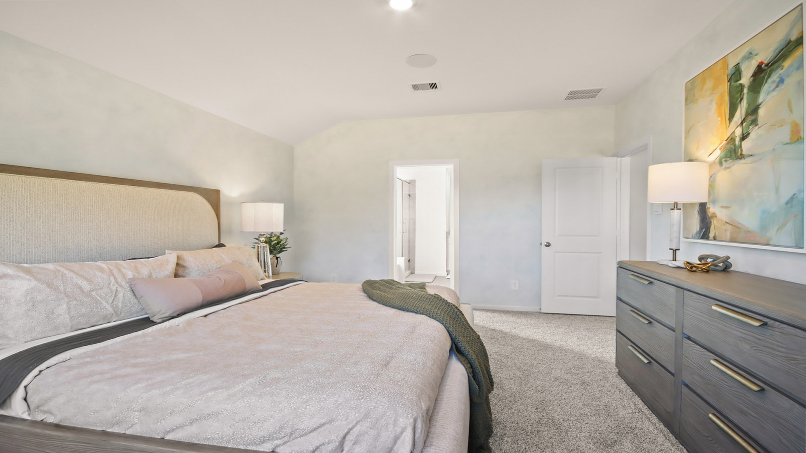 Large Primary bedroom with shag carpet flooring and bright window