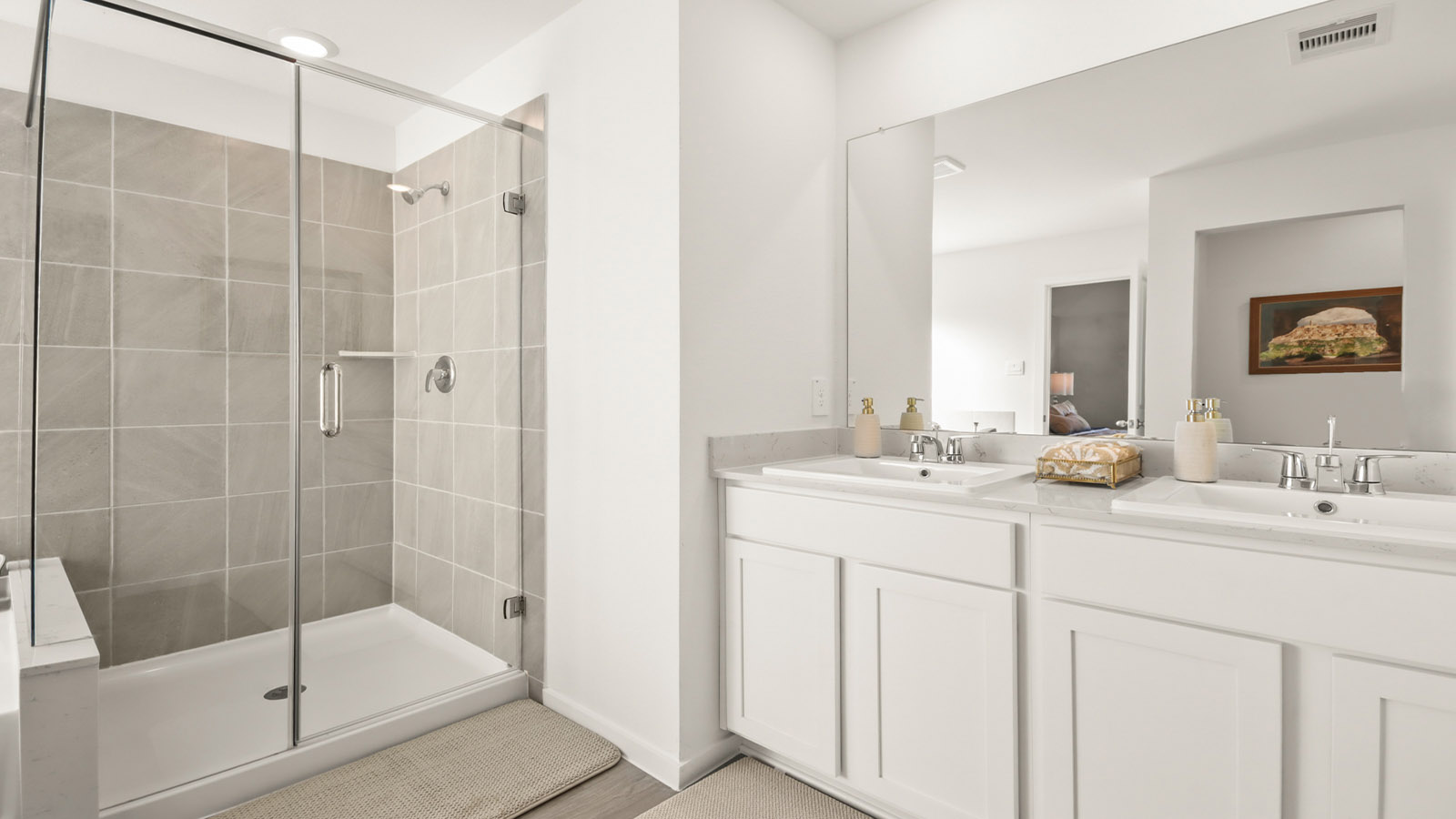 Primary bathroom with tile shower and semi-frameless glass and separate toilet room in Magnolia TX