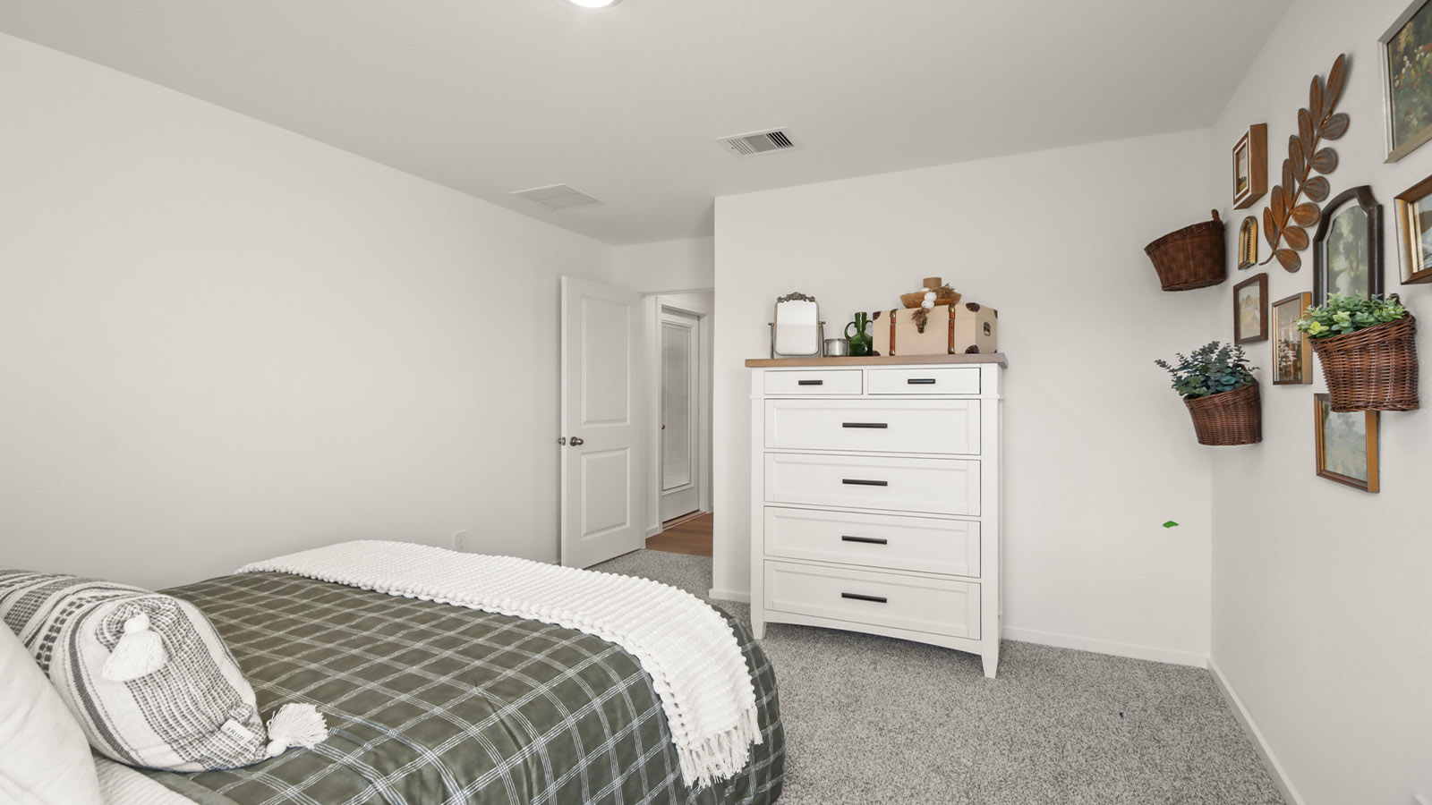 Secondary bedroom with shag carpet flooring and bright window
