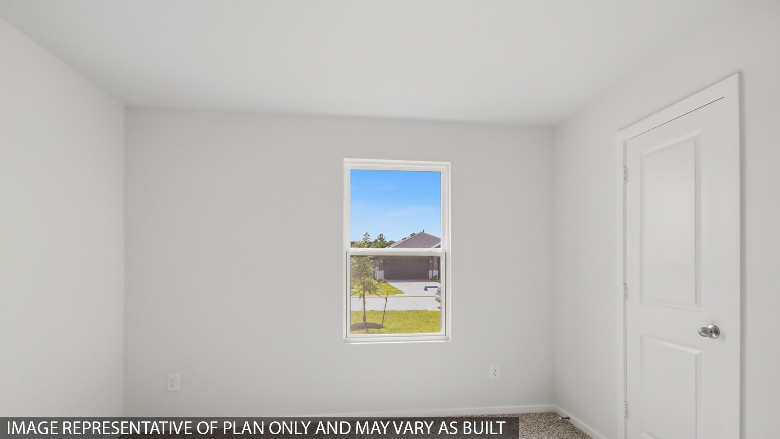 Secondary bedroom with shag carpet flooring and bright window