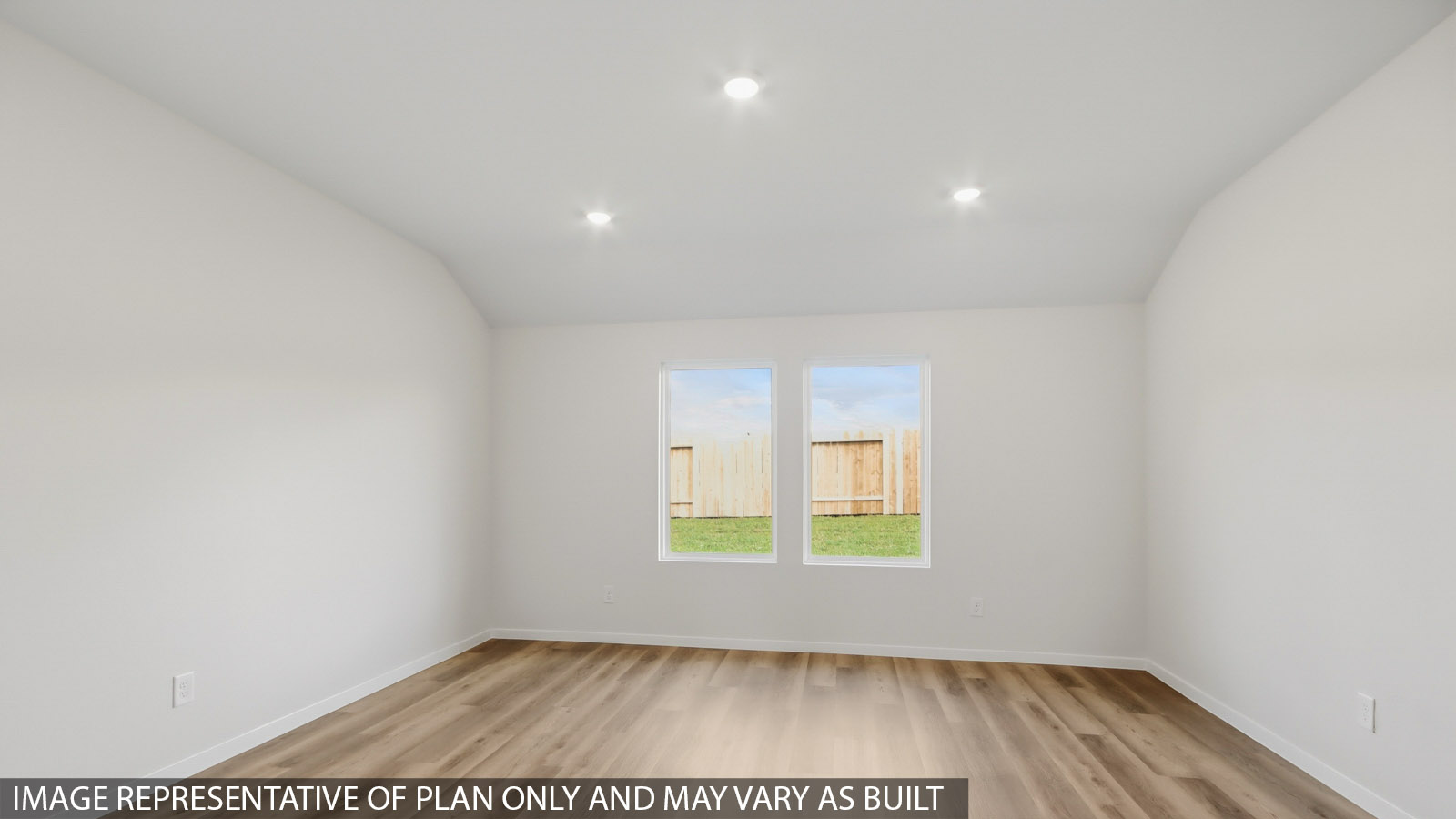 Spacious living area with vinyl flooring and bright windows in Magnolia TX