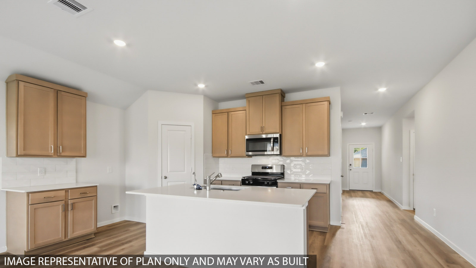 Kitchen with quartz countertops and marden hardware and an island and vinyl floor