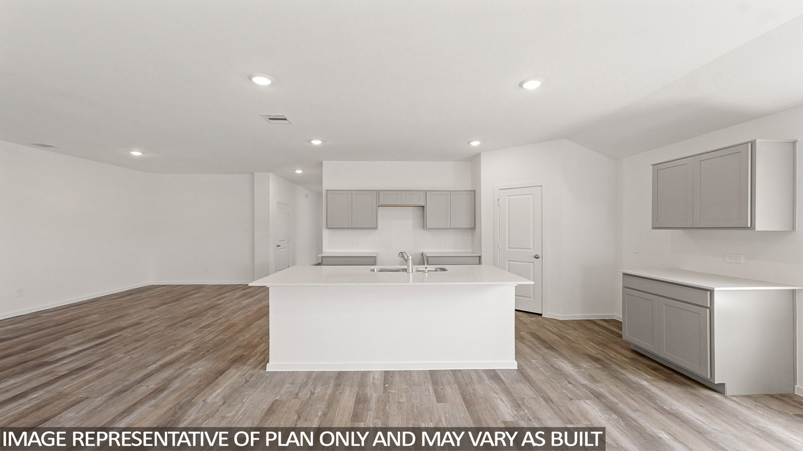 Kitchen with an island and vinyl floor
