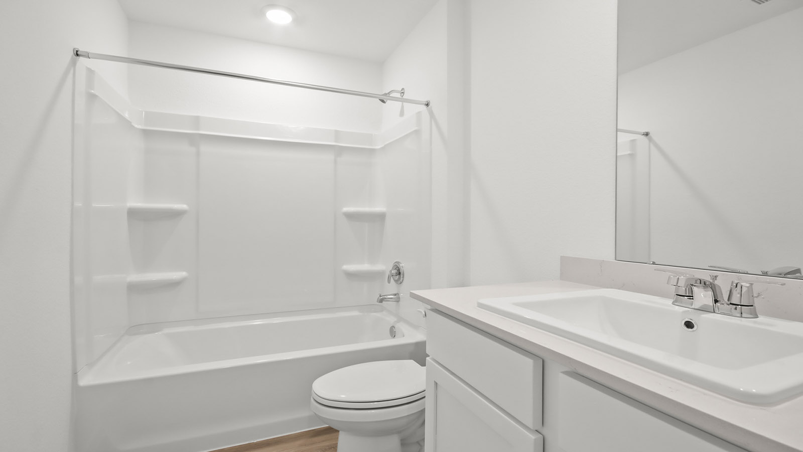Secondary bathroom with tub/shower combo with quartz counter tops in Magnolia TX