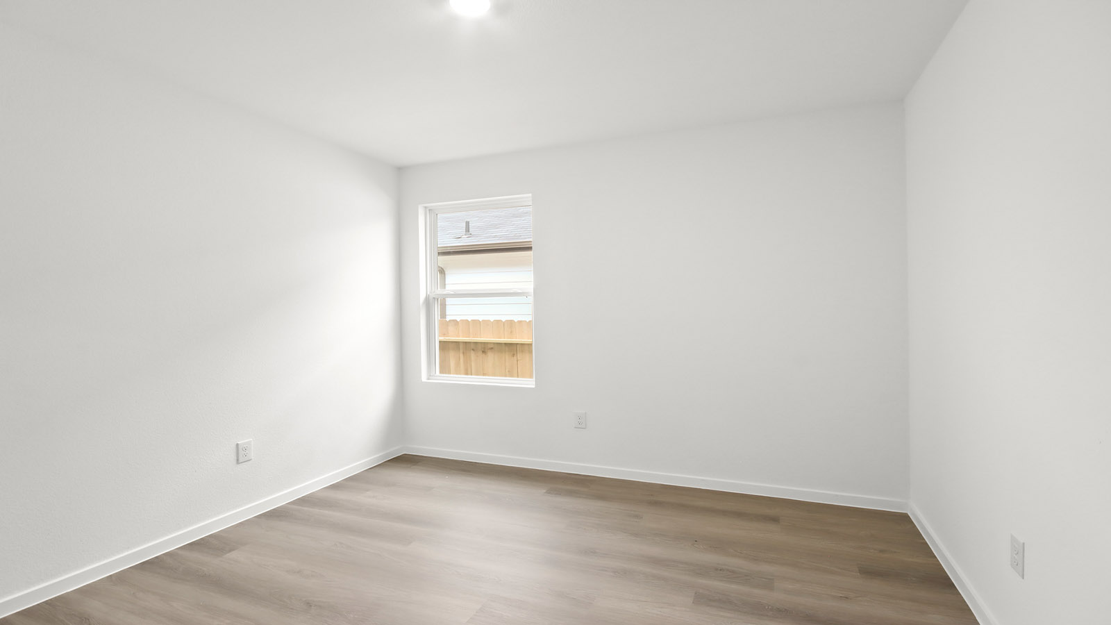 Dining area with vinyl flooring located off from the living room area in Magnolia TX