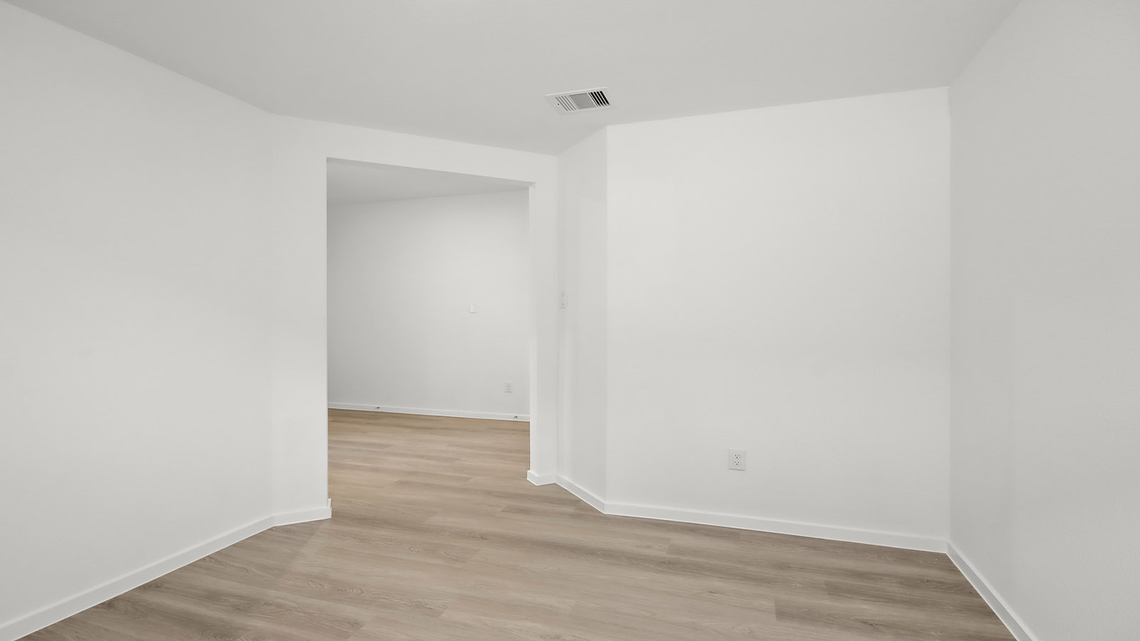 Dining area with vinyl flooring located off from the living room area in Magnolia TX