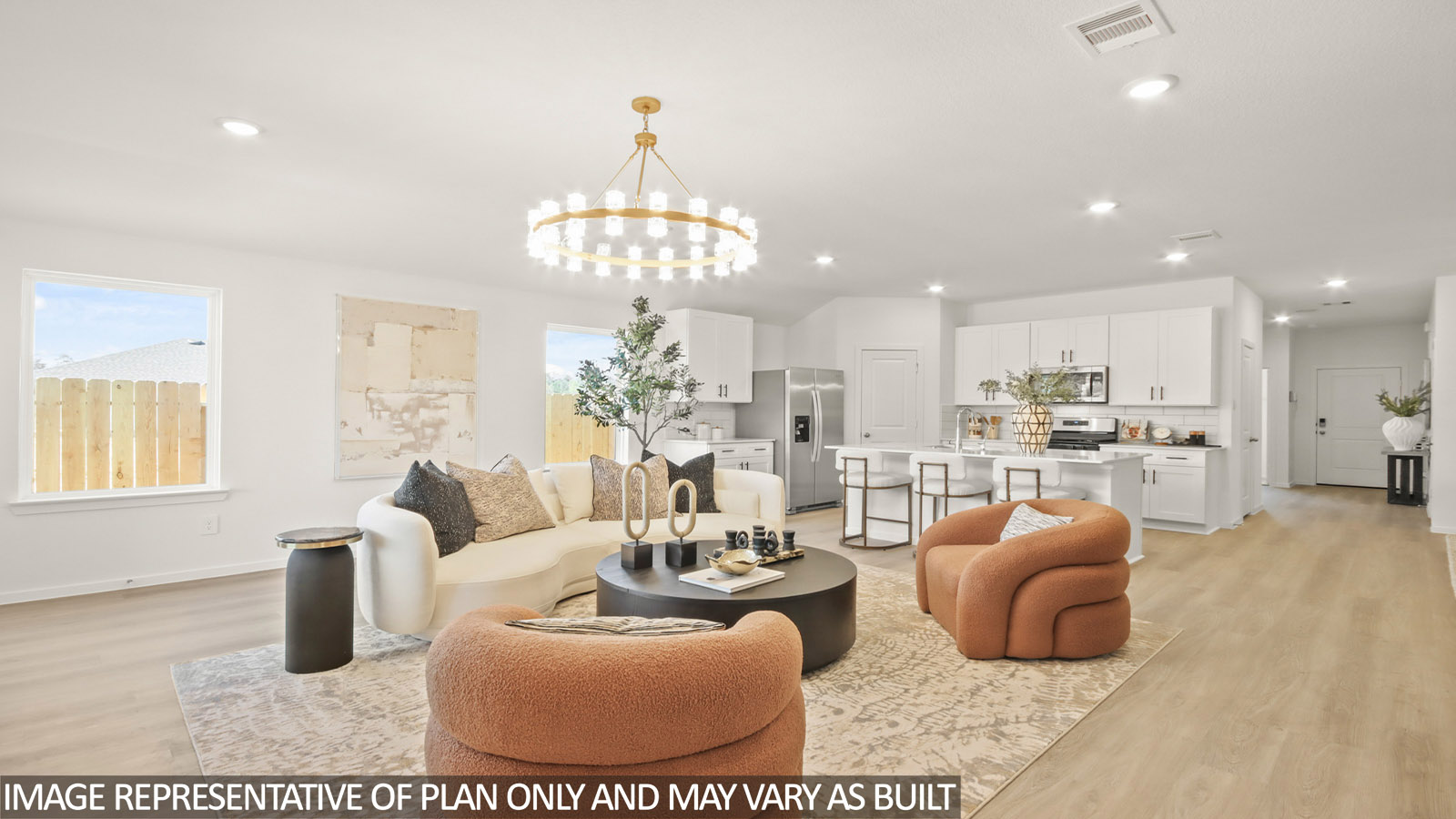 Kitchen with quartz countertops and marden hardware and an island and vinyl floor