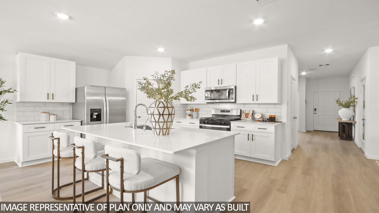Kitchen with quartz countertops and marden hardware and an island and vinyl floor
