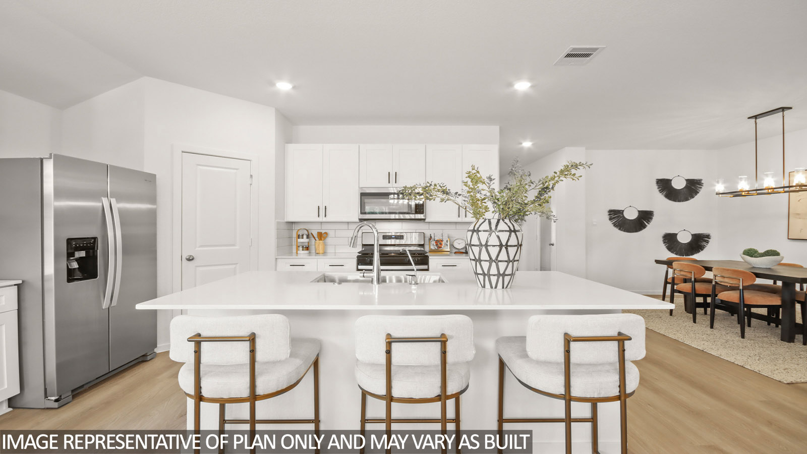 Kitchen with quartz countertops and marden hardware and an island and vinyl floor