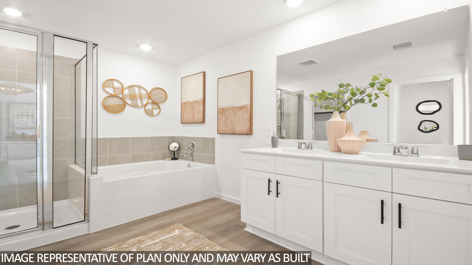 Primary bathroom with soaker tub and tile shower with semi frameless glass in Magnolia TX