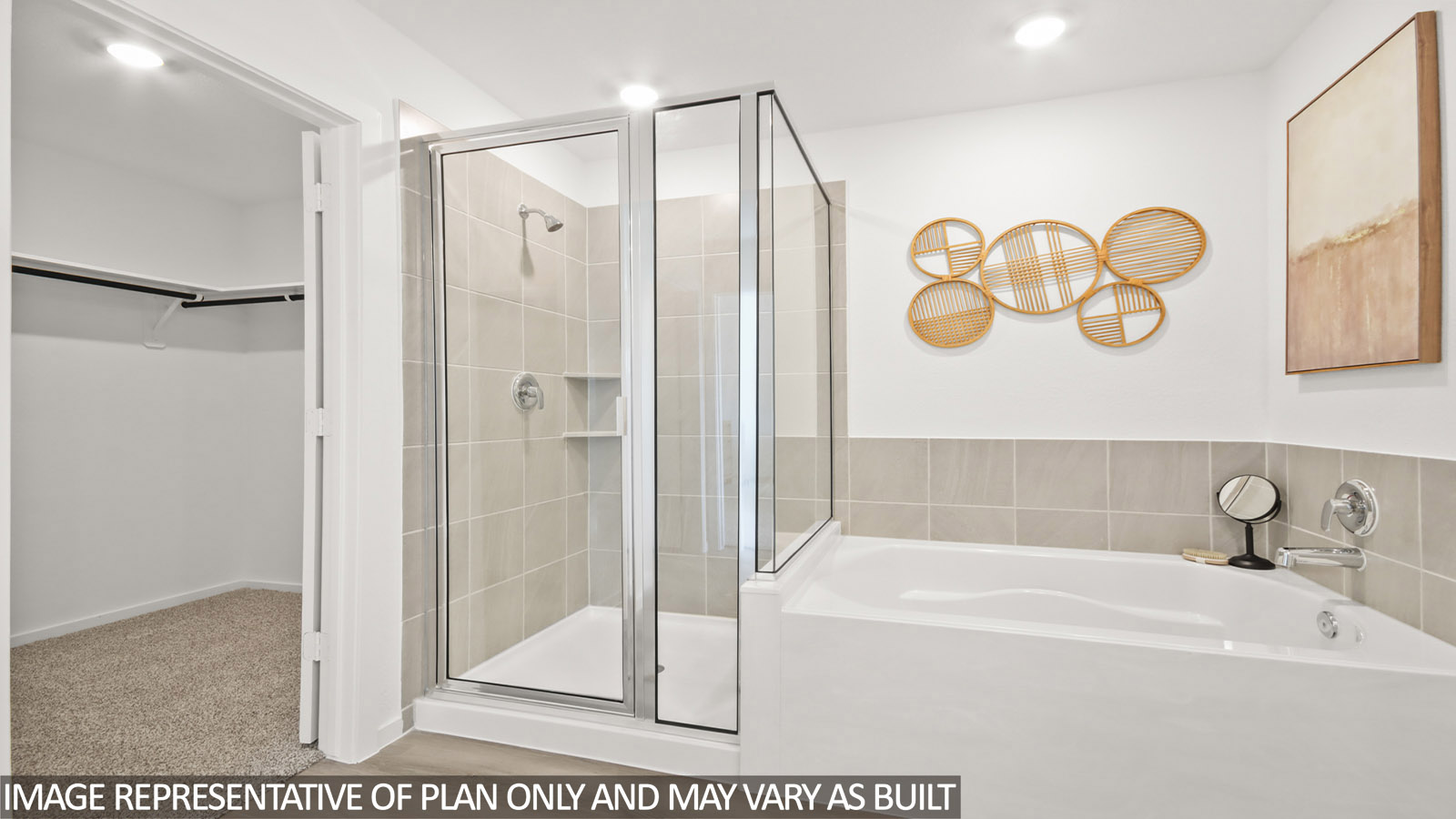 Primary bathroom with soaker tub and tile shower with semi frameless glass in Magnolia TX