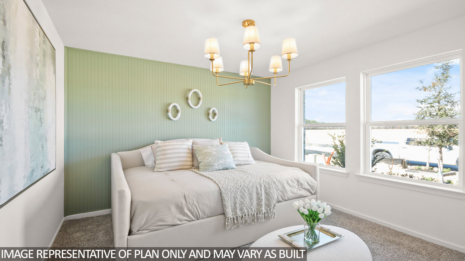 Secondary bedroom with shag carpet flooring and bright window