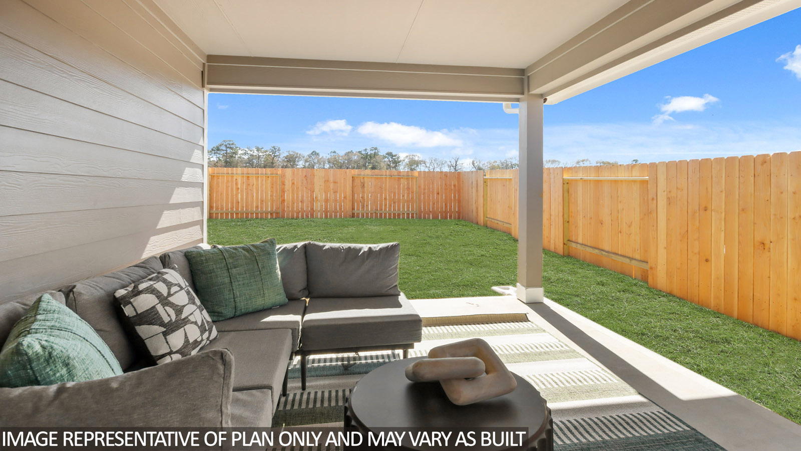 covered patio with jamies hardie siding and overhead lighting