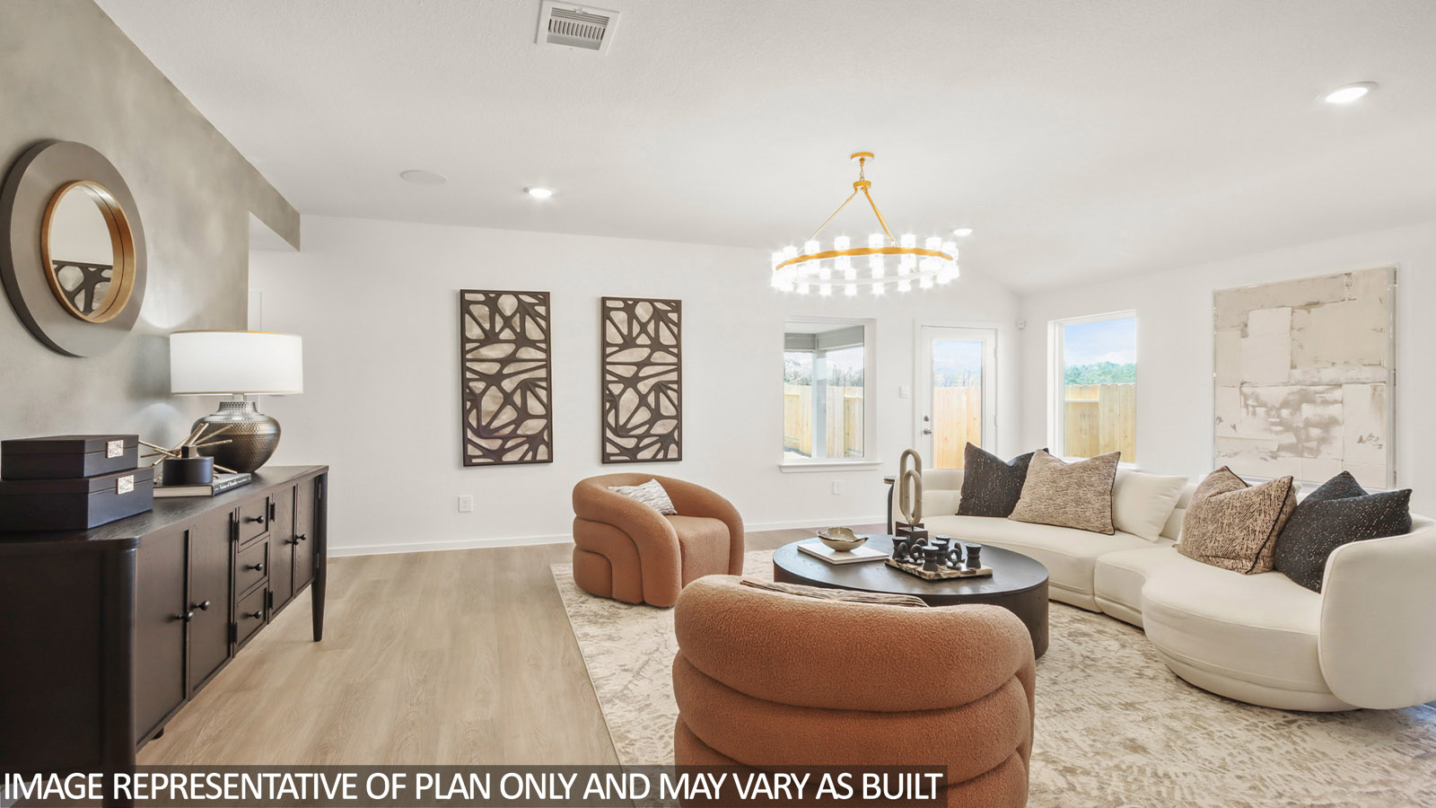Spacious living area with vinyl flooring and bright windows in Magnolia TX