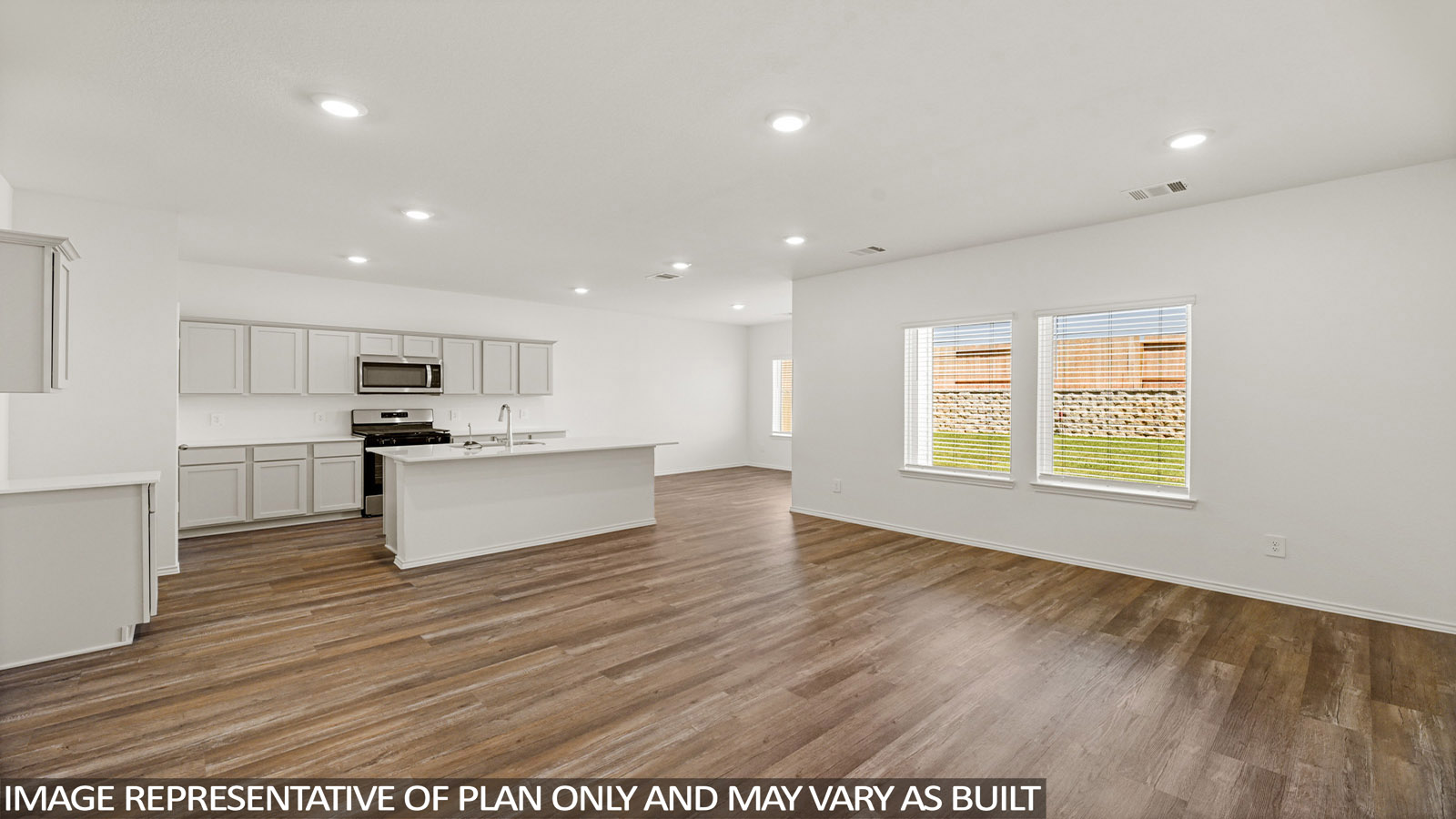 Open concept living, dining, and kitchen area